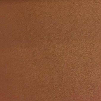 Rugiano leather rug, warm brown, smooth texture with fine grain; indoor collection model NU 131, consistent color and diffused lighting.